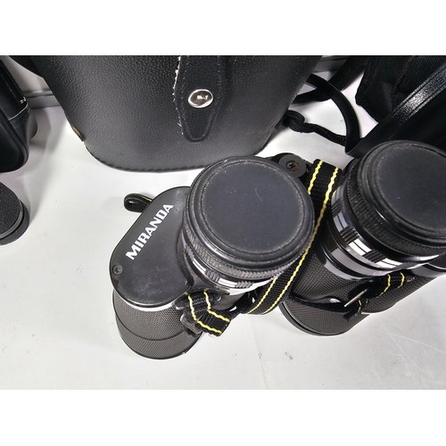 168 - A collection of 3x cased binoculars to include a cased pair of Helios 10x50 binoculars, a pair of Pr... 