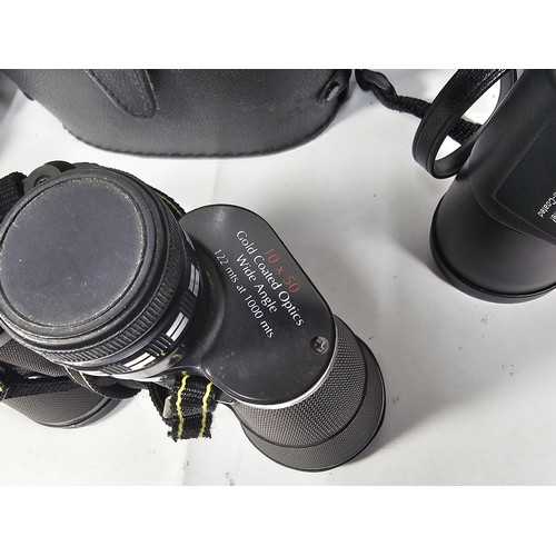 168 - A collection of 3x cased binoculars to include a cased pair of Helios 10x50 binoculars, a pair of Pr... 