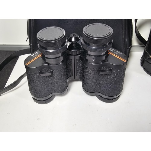 168 - A collection of 3x cased binoculars to include a cased pair of Helios 10x50 binoculars, a pair of Pr... 