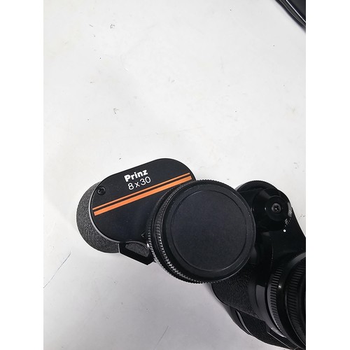 168 - A collection of 3x cased binoculars to include a cased pair of Helios 10x50 binoculars, a pair of Pr... 