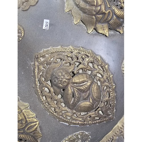 169 - An antique early 20th century Indo-Persian metal Dhal shield with grip bar, the shield is decorated ... 