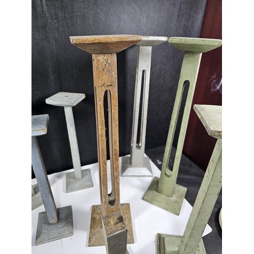 178 - A collection of 11x good quality wooden pillar candle stands two include 5x candle stands with open ... 