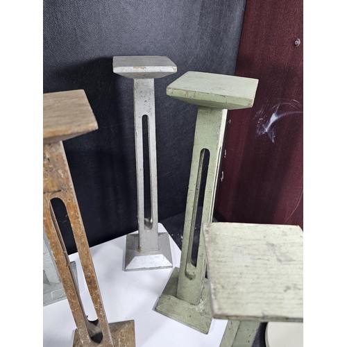 178 - A collection of 11x good quality wooden pillar candle stands two include 5x candle stands with open ... 