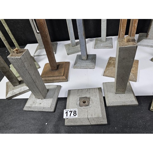 178 - A collection of 11x good quality wooden pillar candle stands two include 5x candle stands with open ... 