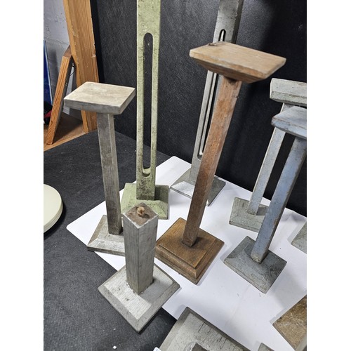 178 - A collection of 11x good quality wooden pillar candle stands two include 5x candle stands with open ... 