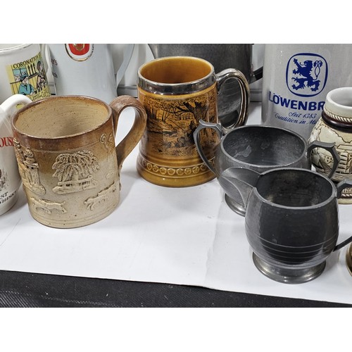 197 - A box containing a quantity of assorted collectable German tankards and steins, to include a earthen... 