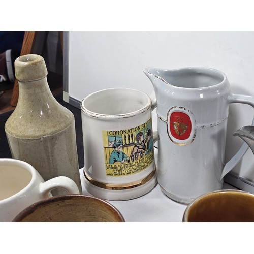 197 - A box containing a quantity of assorted collectable German tankards and steins, to include a earthen... 