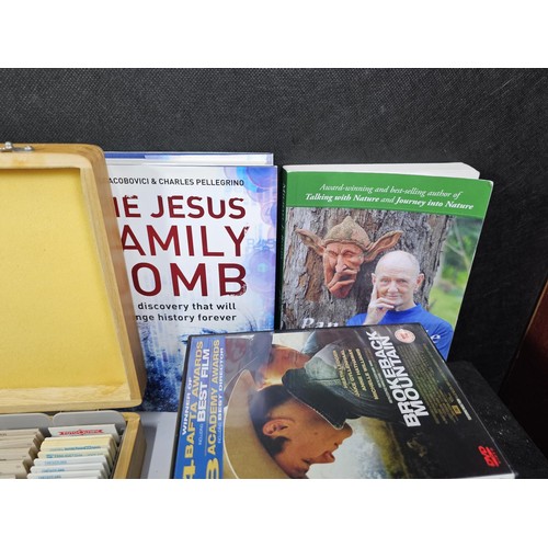 182 - A collection of books and DVD's and CD's to include Brokeback Mountain, The Contender, The Hunter et... 