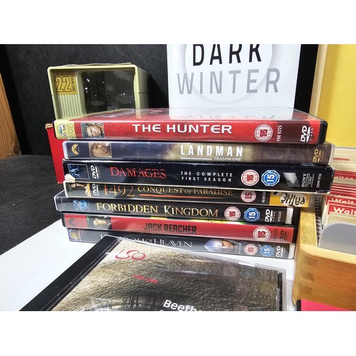 182 - A collection of books and DVD's and CD's to include Brokeback Mountain, The Contender, The Hunter et... 