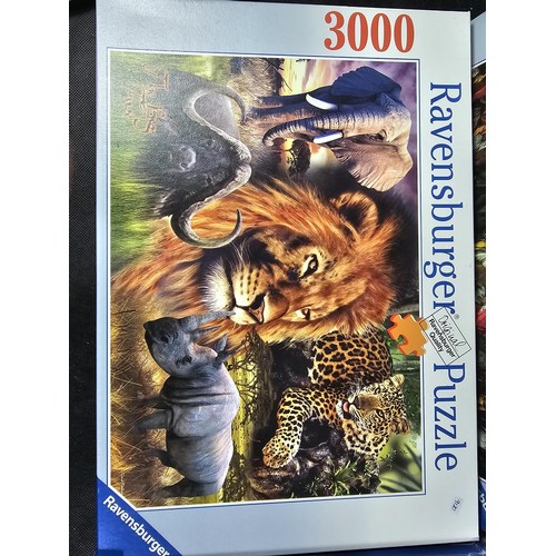 183 - A collection of 4x jigsaws to include 3x 3000 piece jigsaws and one 2000 piece by Waddingtons and Ra... 