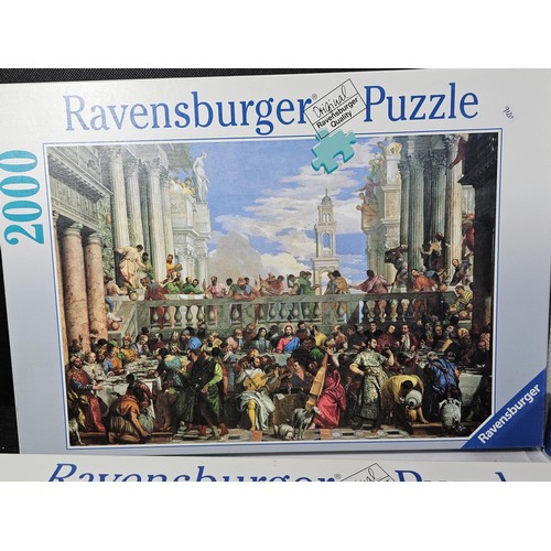 183 - A collection of 4x jigsaws to include 3x 3000 piece jigsaws and one 2000 piece by Waddingtons and Ra... 