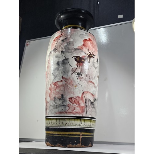 203 - A large earthenware floor standing vase with hand painted decoration to the side showing the image o... 