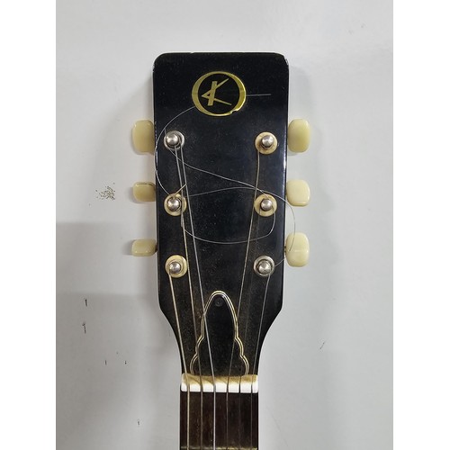205 - A Kay 310 vintage dreadnought acoustic guitar, made in Japan circa 1970's, has the decorative bat wi... 