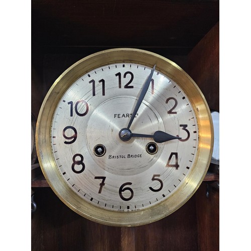 208 - A vintage Vienna wall clock with a metal dial stamped Fear's Ltd Bristol Bridge made in Baden. The c... 