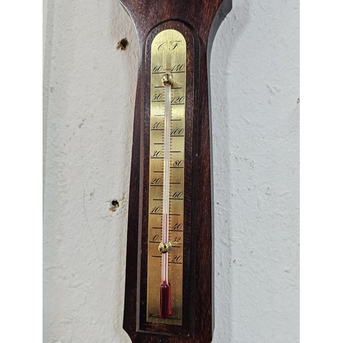 209 - A modern, mahogany banjo barometer by Weathermaster with a barometer to the base and thermometer to ... 