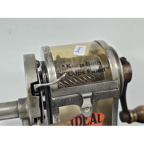 212 - A good quality vintage well preserved Ideal, hand crank pencil sharpener featuring its original labe... 
