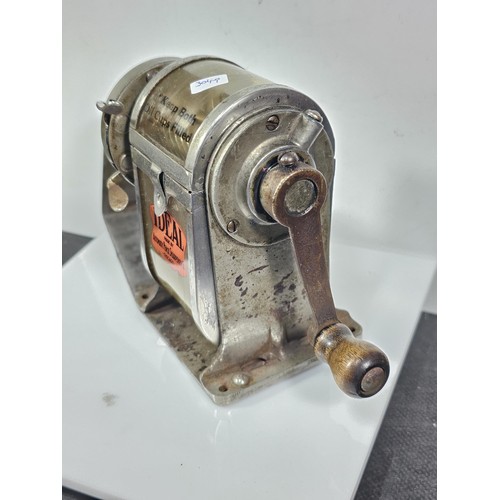 212 - A good quality vintage well preserved Ideal, hand crank pencil sharpener featuring its original labe... 