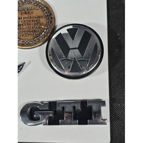 213 - A collection of car related items to include a Rover Viking bonnet mount, a Sunbeam Talbot bonnet ba... 