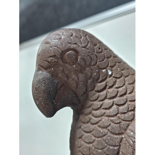 216 - A good quality metal outdoor parrot formed ornament on a metal base, the parrot is well detailed and... 
