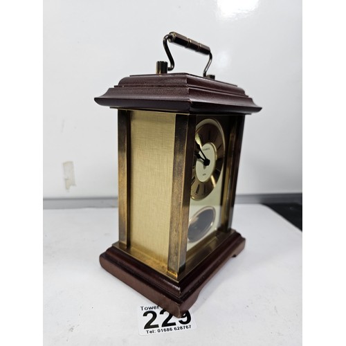 229 - A vintage H.Samuel wooden, mantel clock with a mechanical movement, the front of the clock is glazed... 