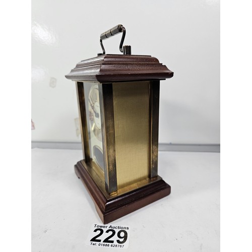 229 - A vintage H.Samuel wooden, mantel clock with a mechanical movement, the front of the clock is glazed... 