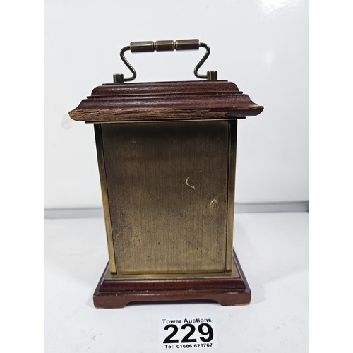 229 - A vintage H.Samuel wooden, mantel clock with a mechanical movement, the front of the clock is glazed... 
