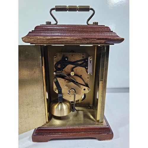 229 - A vintage H.Samuel wooden, mantel clock with a mechanical movement, the front of the clock is glazed... 