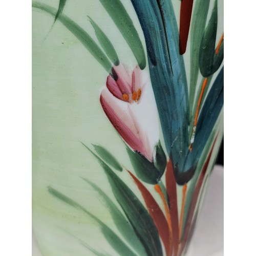 234 - A shelf full of collectable pieces to include a pair of hand painted Vaseline vases a hand painted f... 