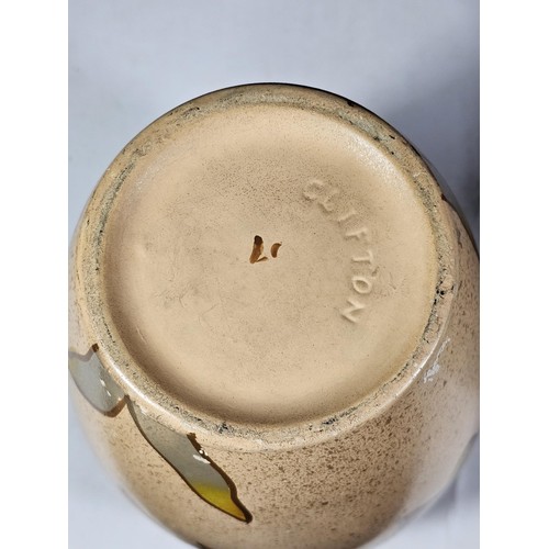 234 - A shelf full of collectable pieces to include a pair of hand painted Vaseline vases a hand painted f... 