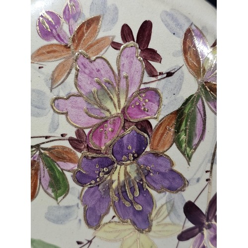 234 - A shelf full of collectable pieces to include a pair of hand painted Vaseline vases a hand painted f... 