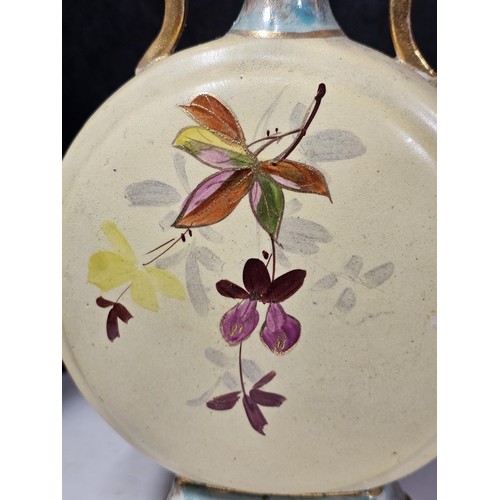 234 - A shelf full of collectable pieces to include a pair of hand painted Vaseline vases a hand painted f... 