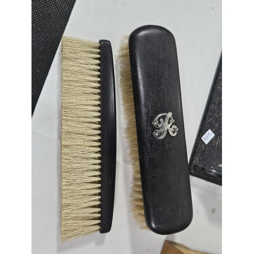 233 - A quantity of collectables to include an ebony dressing table set consisting of a pair of brushes st... 