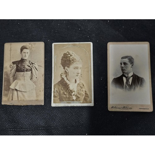 215A - A large collection of approx 56 antique photographic cards featuring various portraits set onto hard... 