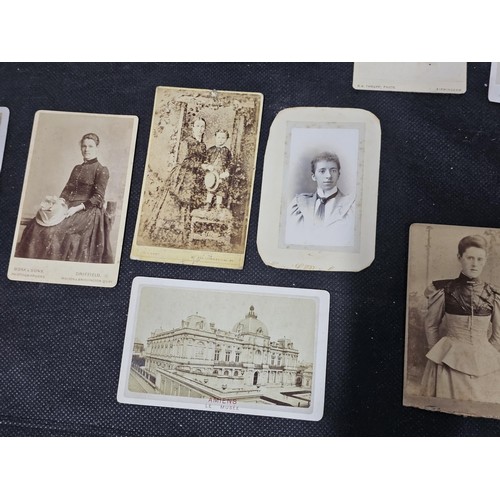 215A - A large collection of approx 56 antique photographic cards featuring various portraits set onto hard... 