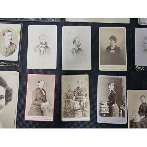 215A - A large collection of approx 56 antique photographic cards featuring various portraits set onto hard... 