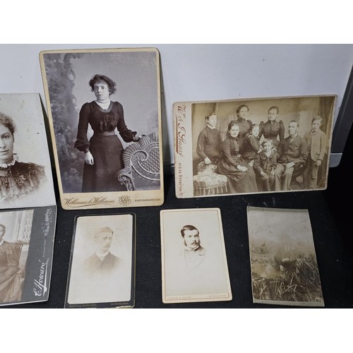 215A - A large collection of approx 56 antique photographic cards featuring various portraits set onto hard... 