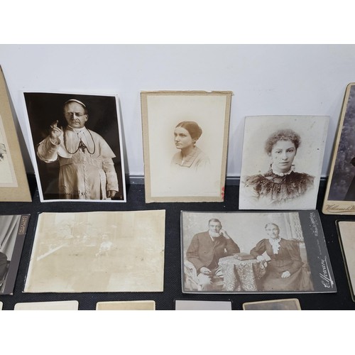 215A - A large collection of approx 56 antique photographic cards featuring various portraits set onto hard... 