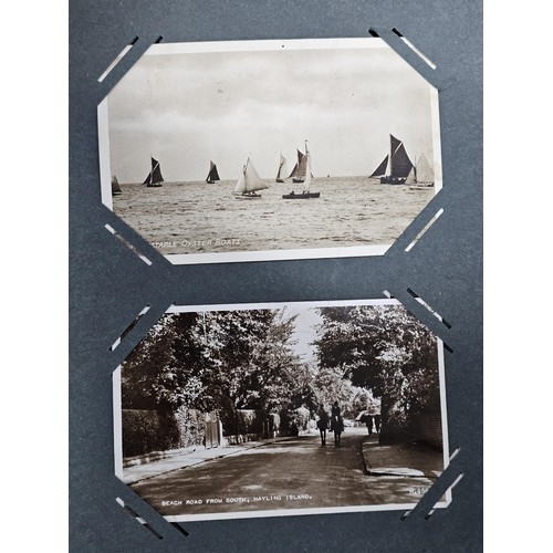 215E - Complete album of vintage and antique postcards to include humorous postcards photographic postcards... 