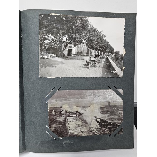 215E - Complete album of vintage and antique postcards to include humorous postcards photographic postcards... 