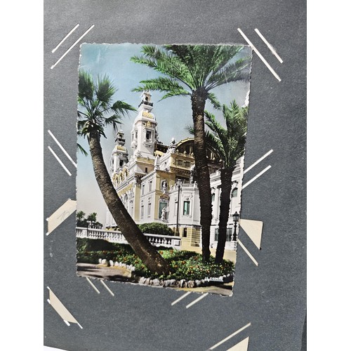 215E - Complete album of vintage and antique postcards to include humorous postcards photographic postcards... 