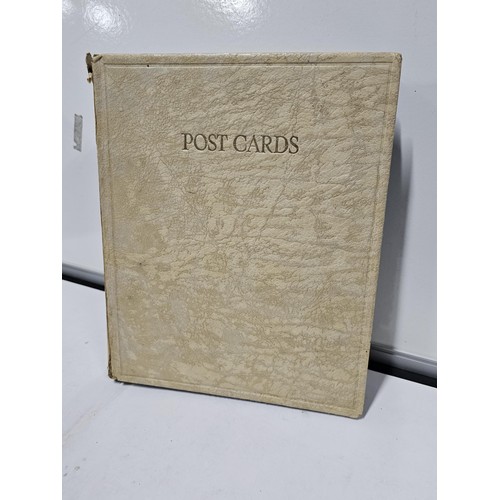 215E - Complete album of vintage and antique postcards to include humorous postcards photographic postcards... 