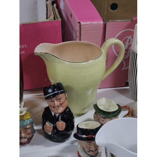 198 - 2x boxes containing a large collection of collectables to include 2x Hornsea ribbed vases in black a... 