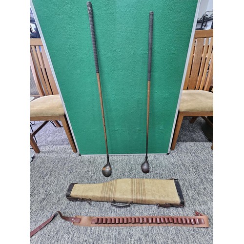 1 - A vintage material gun hardcase along with a cartridge and belt, also includes 2 vintage Hickory sha... 