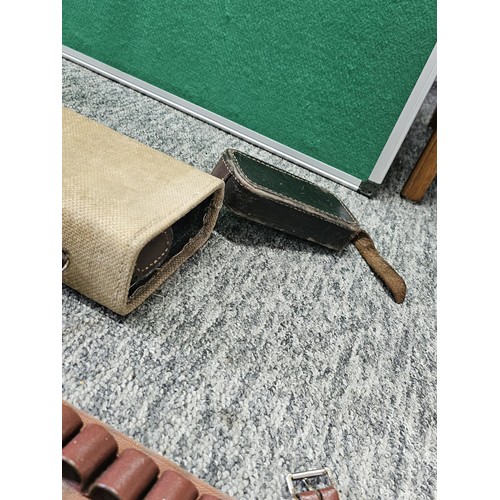 1 - A vintage material gun hardcase along with a cartridge and belt, also includes 2 vintage Hickory sha... 