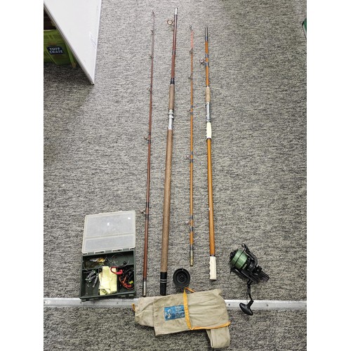 2 - 2 cork handled fishing rods, both are 2 piece with the corks and eyes in good order, complete with a... 
