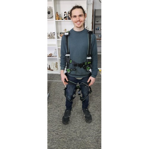 11 - Miller “Revolution” full‑body safety harness, black webbing with green stitching, fitted with multip... 
