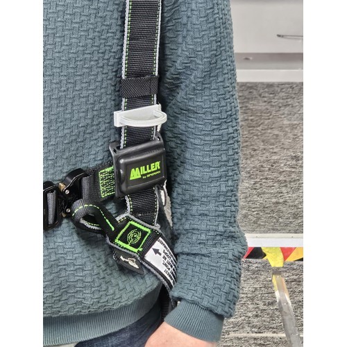 11 - Miller “Revolution” full‑body safety harness, black webbing with green stitching, fitted with multip... 