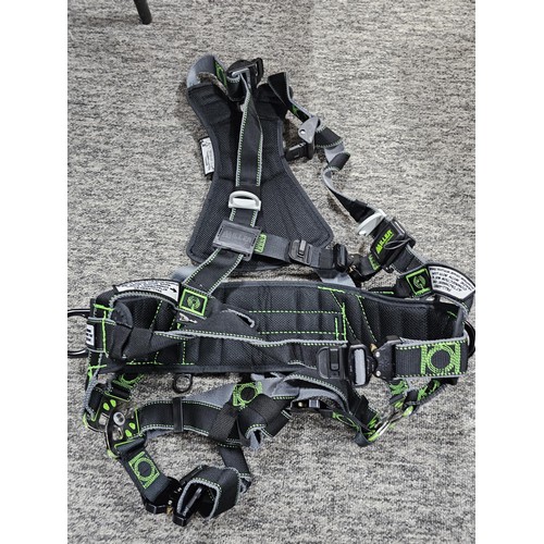 11 - Miller “Revolution” full‑body safety harness, black webbing with green stitching, fitted with multip... 