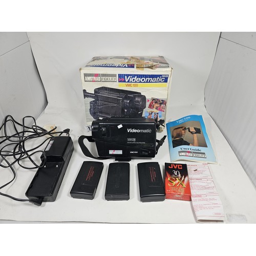 19 - An original boxed Amstrad Videomatic VMC100 portable VHS recorder complete with camera, 3x batteries... 