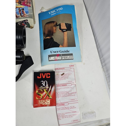 19 - An original boxed Amstrad Videomatic VMC100 portable VHS recorder complete with camera, 3x batteries... 